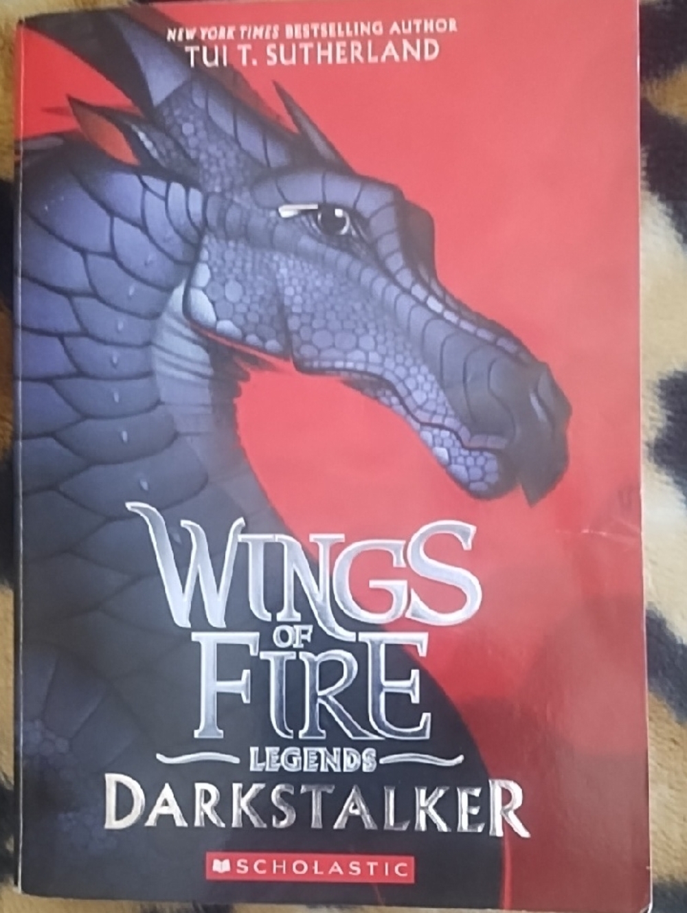 Scholastic Wings of Fire Legends: Darkstalker — Blue Dragon on Red Cover